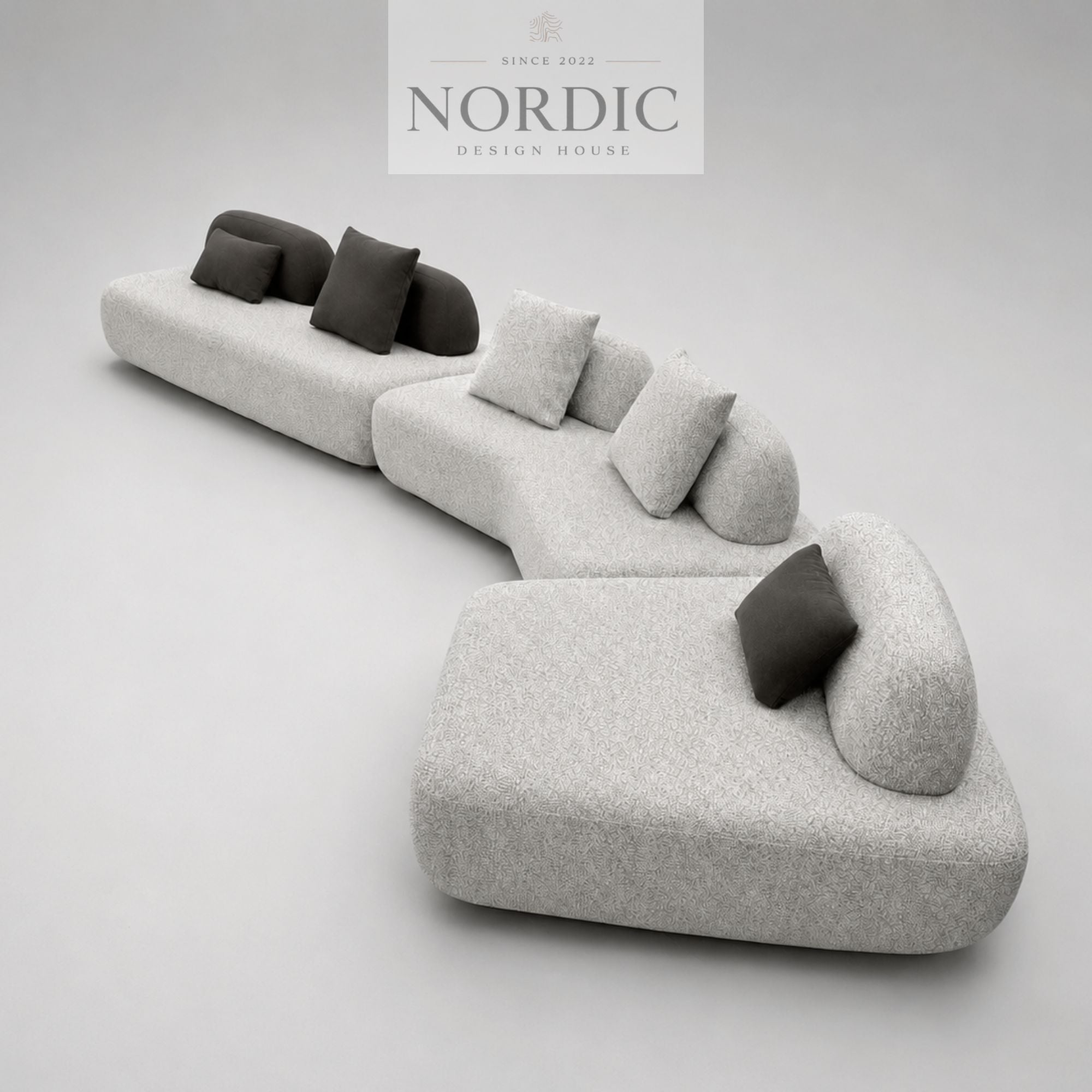 Moderne modulsofa i lys grå stof med puder til stue, lounge og åbne rum