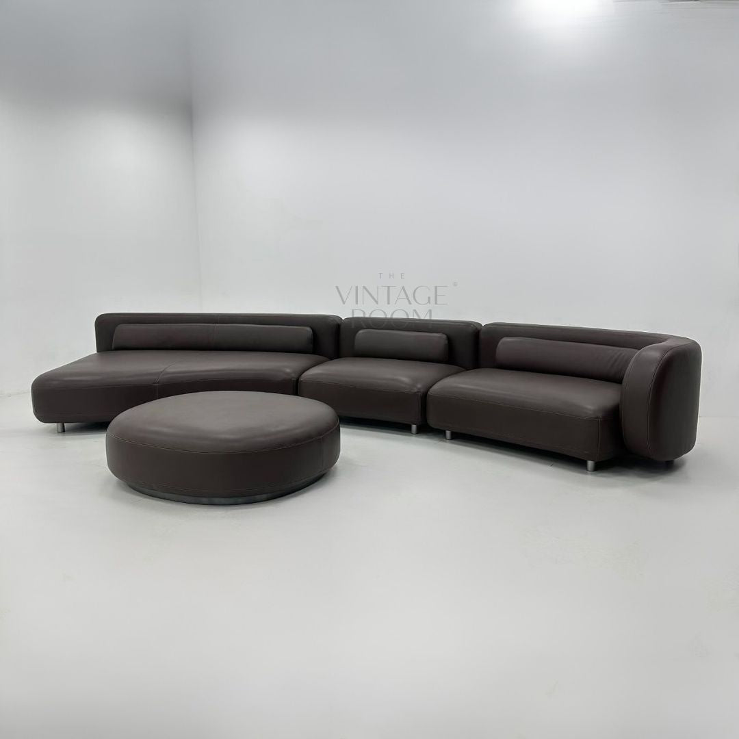 High-end design leather sofa with ottoman in premium leather and modular lounge design