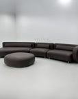 High-end design leather sofa with ottoman in premium leather and modular lounge design