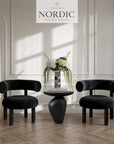 Skulpturelt sort sidebord Obsidia med organisk form