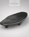 Sort organisk sofabord med skulpturelt design til moderne boligindretning